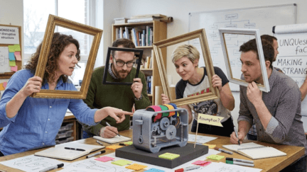 designers framing a problem- holding up frames around the product